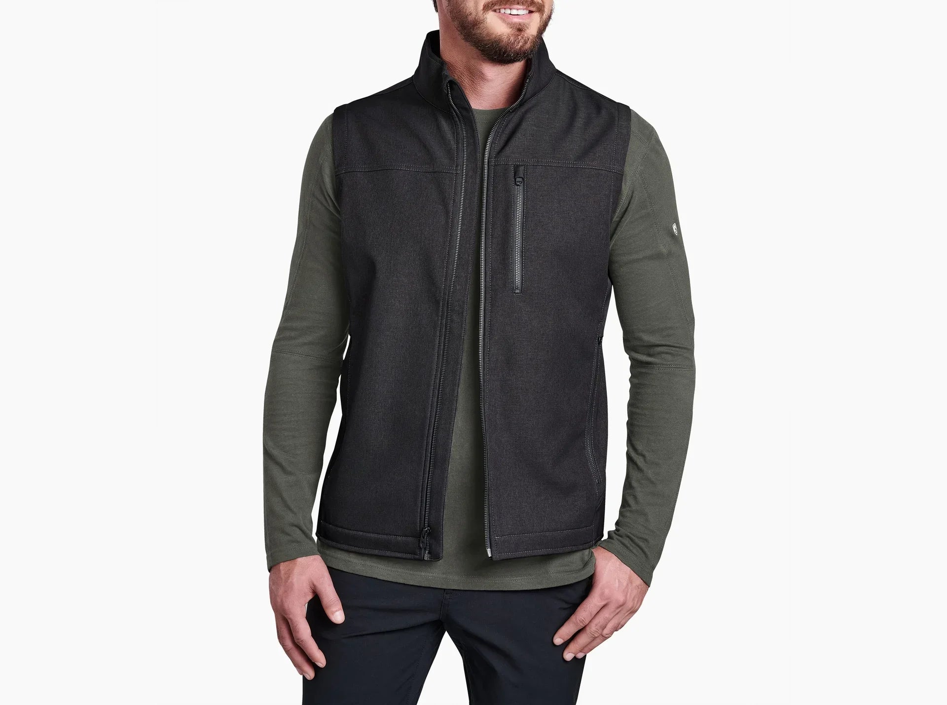 Man wearing a KUHL IMPAKT™ VEST Durable Comfort black and green fleece vest for everyday wear.