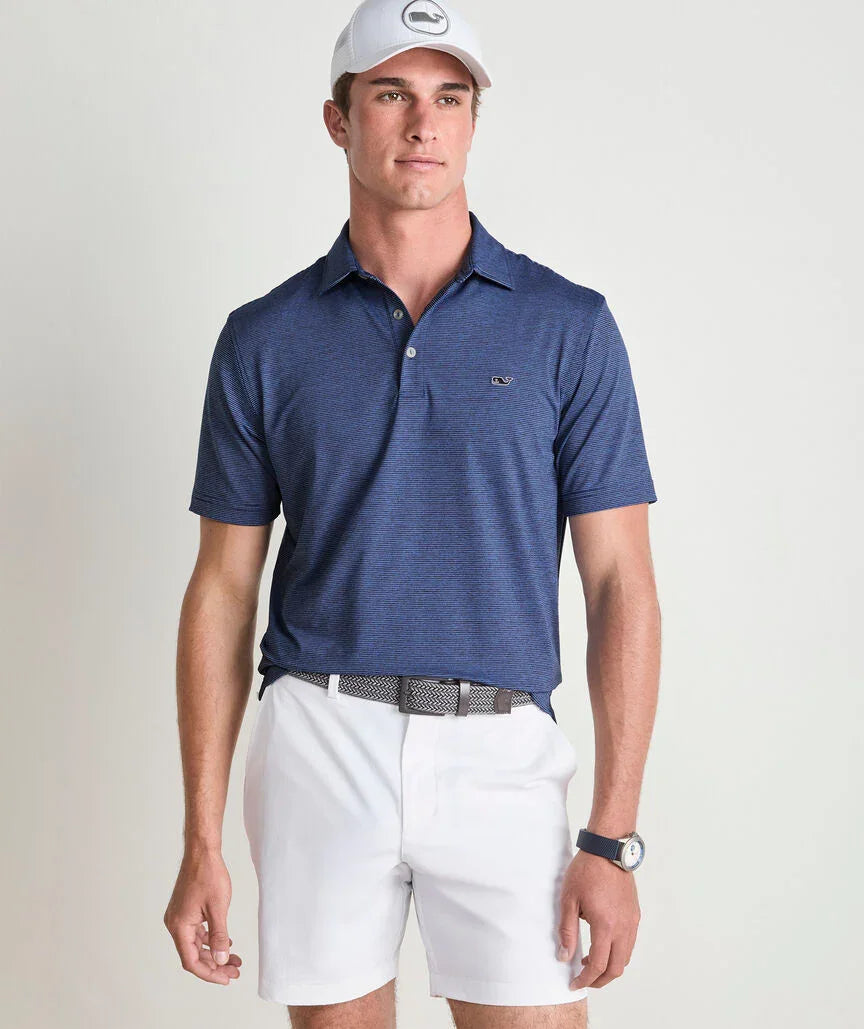 a man wearing, Sankaty Performance Polo, a blue polo shirt and white shorts with a neutral background for men outdoor, casual, or formal wear