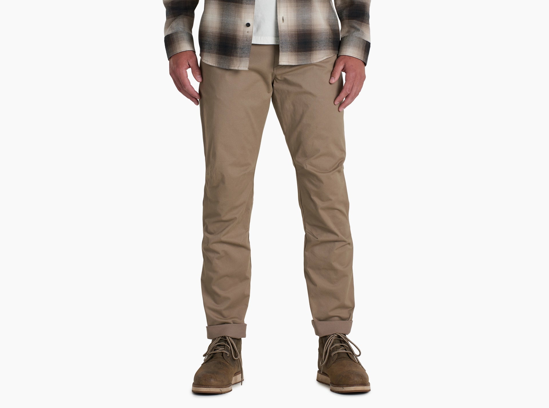 Person wearing beige pants and a plaid shirt on a white background for outdoor, casual or formal wear. 