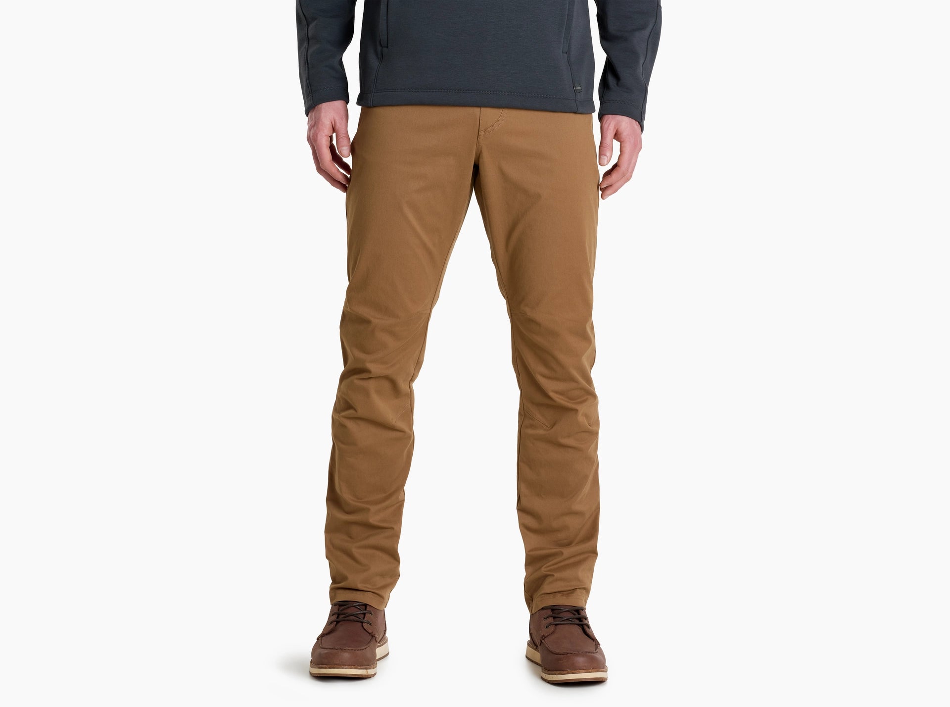 Person wearing brown pants on a white background for outdoor, casual or formal wear. 
