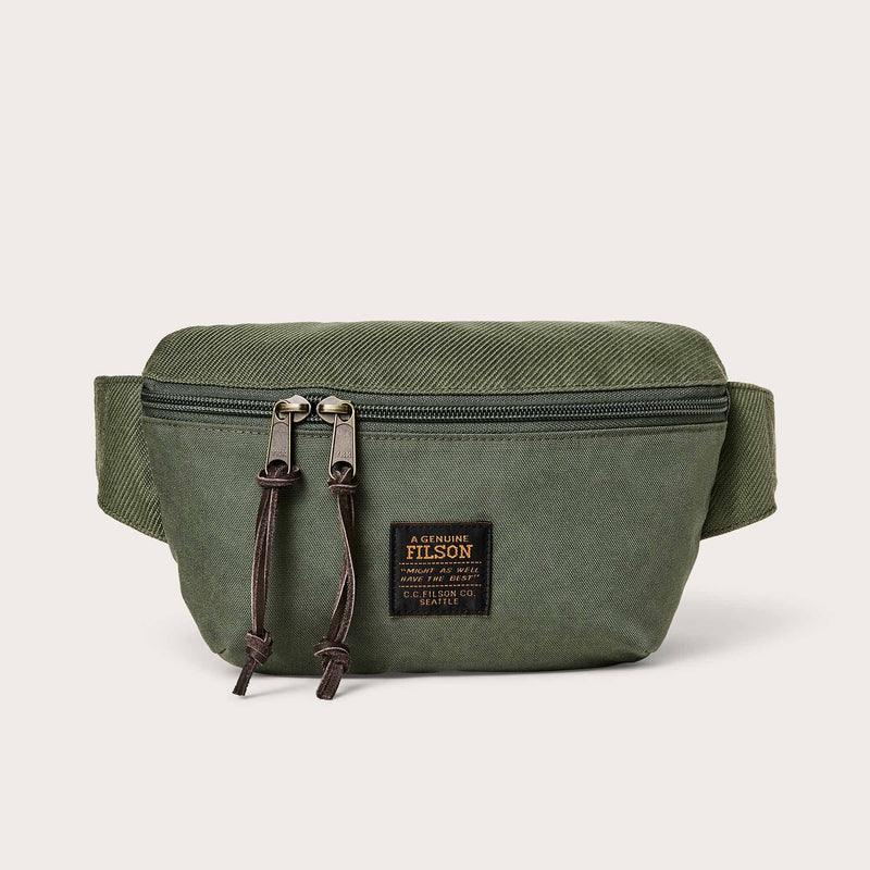 Filson Surveyor Crossbody Pack in green with zippered compartments, durable fabric, and adjustable crossbody strap.