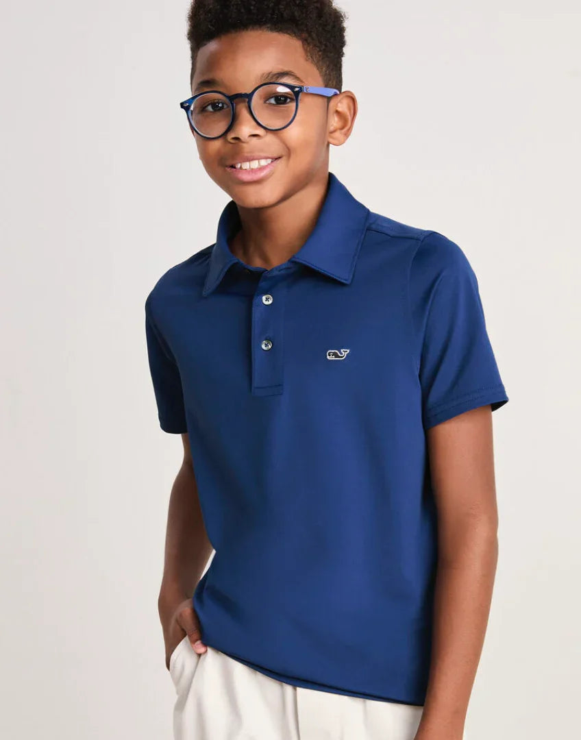 Boy wearing Vineyard Vines Youth St. Jean Stripe Sankaty Polo outdoors