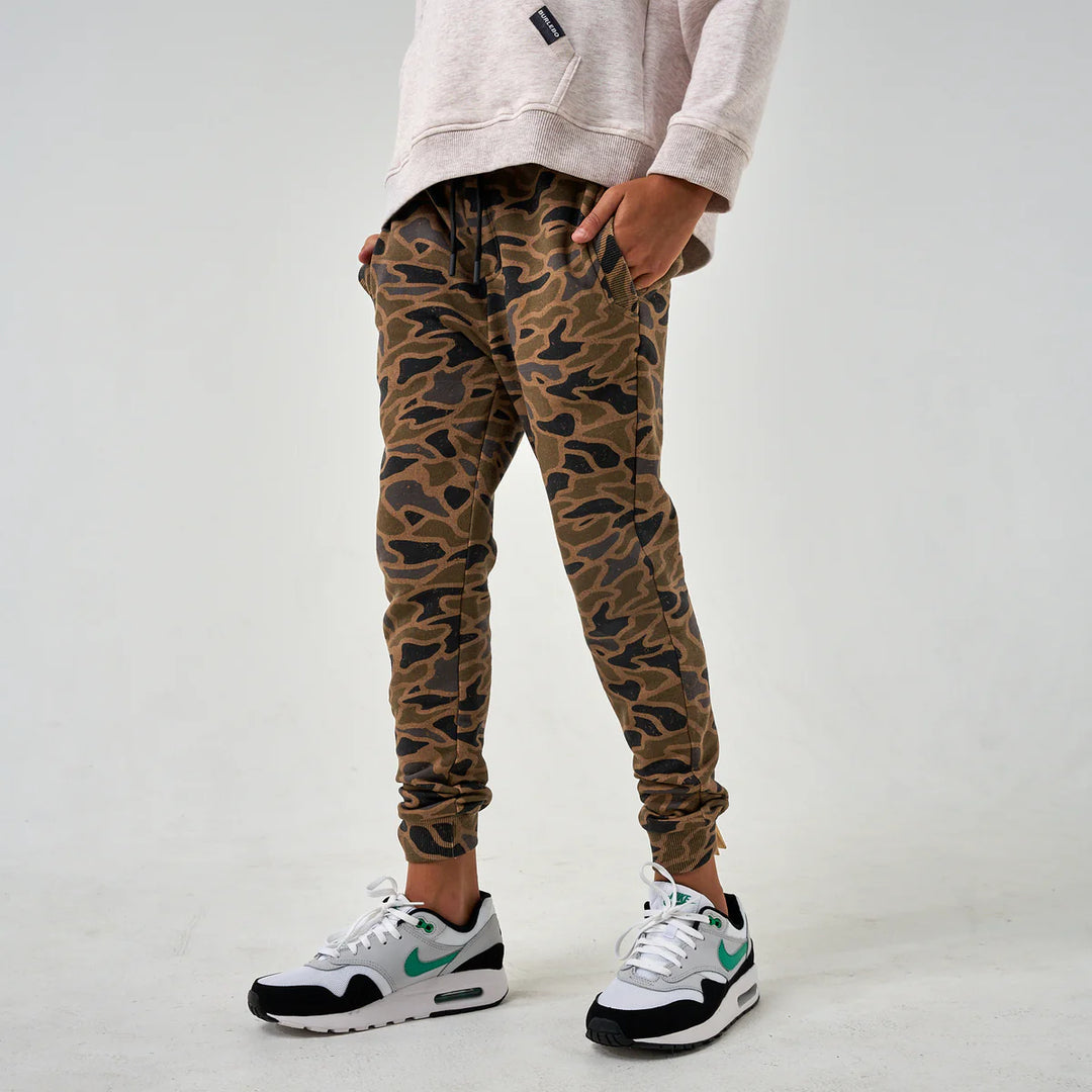 Burlebo Youth Fleece Jogger in Camo with elastic waistband, ribbed cuffs, and soft polyester fabric.