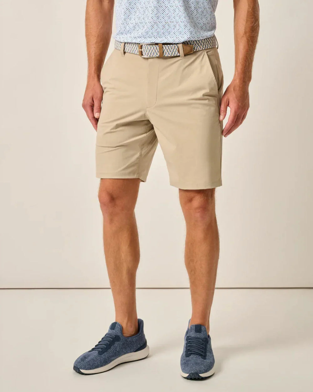 a man wearing Johnnie O Fusion Knit Performance Comfort Pull-On Short-Beige